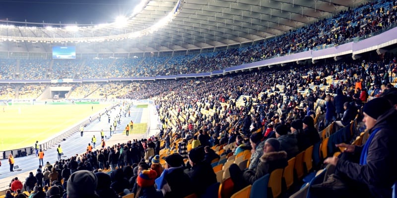 Fans watching football game at stadium